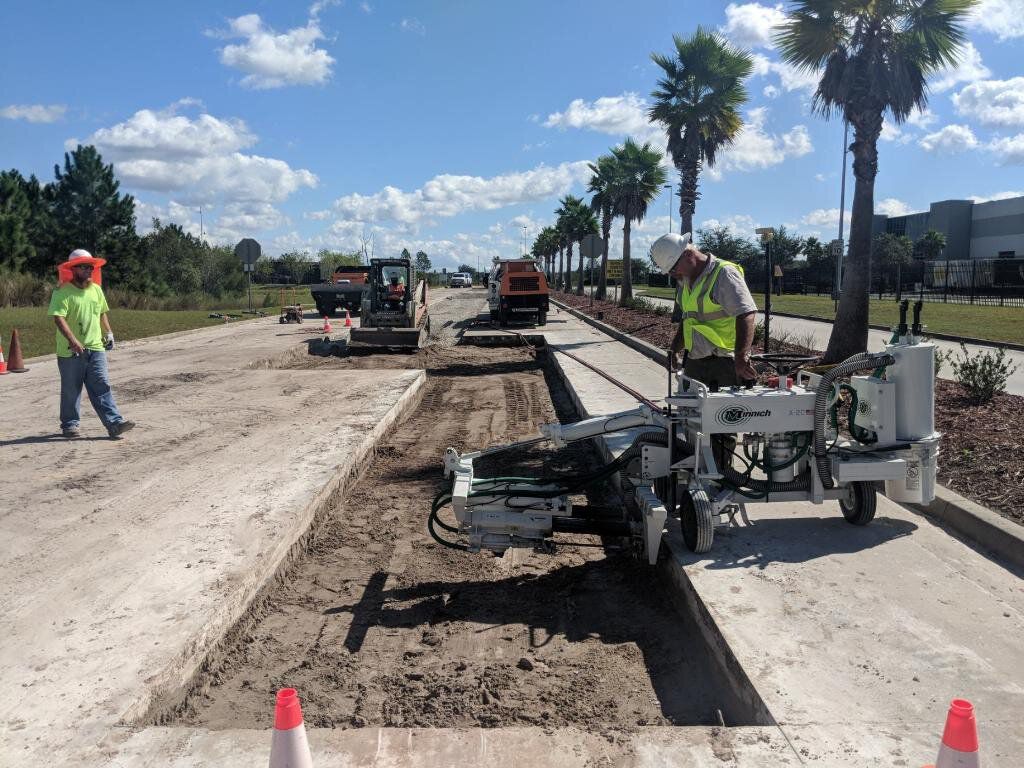 Extruded curb run along a new drive