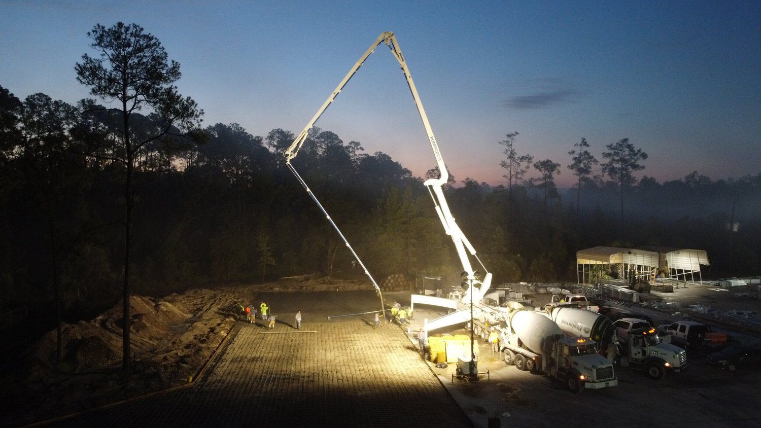 Night concrete placement with a boom pump on a commercial site in North Florida
