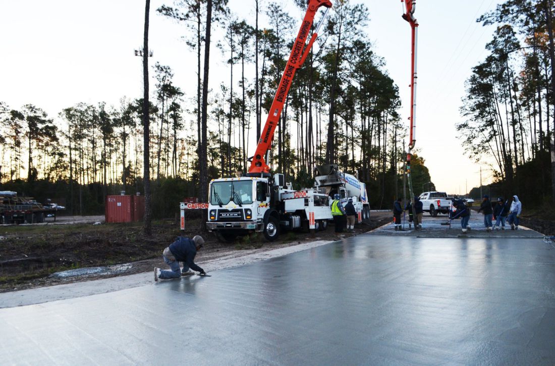 Two pumps feeding a wide pavement placement