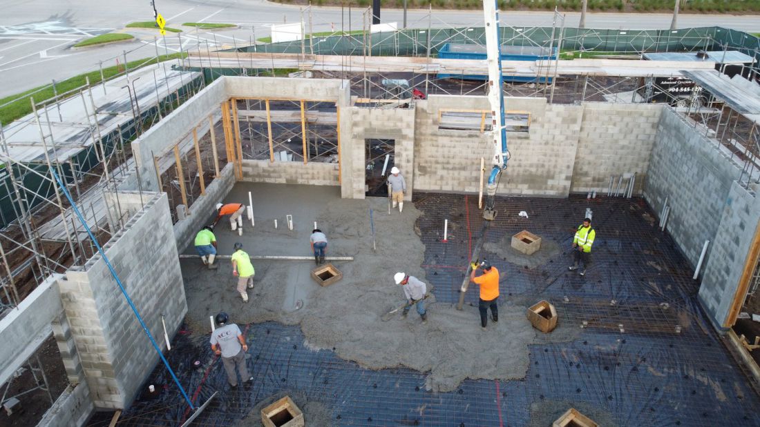 Build-out slab poured within finished block walls