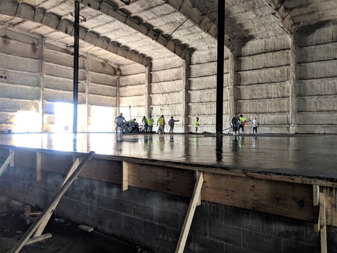 New floor slab inside a standing warehouse