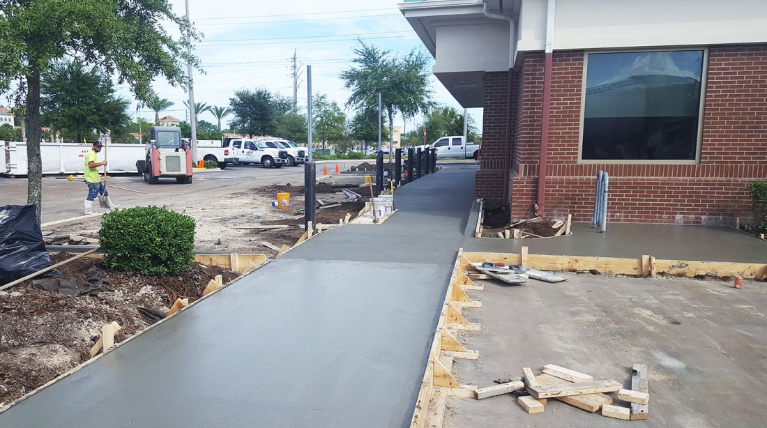 Fresh walkway poured tight to an existing storefront