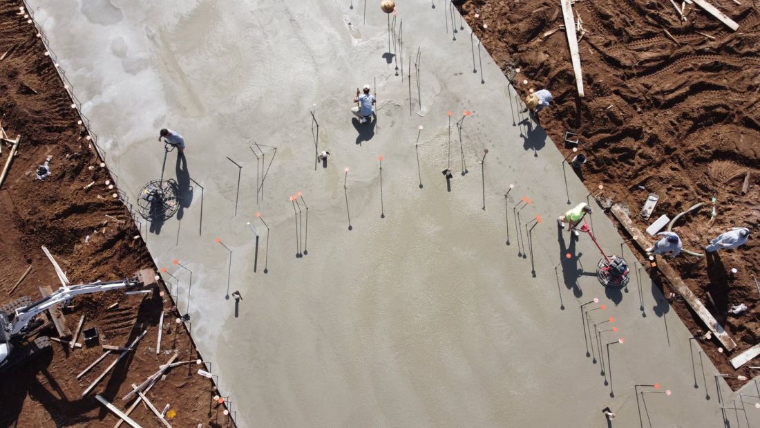 Anchor bolts and embeds set in a fresh structural slab