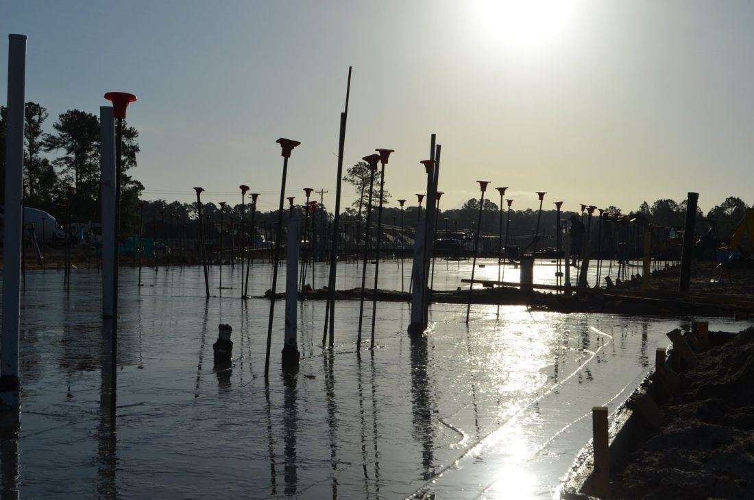 Pile caps and marine foundation work at sunset