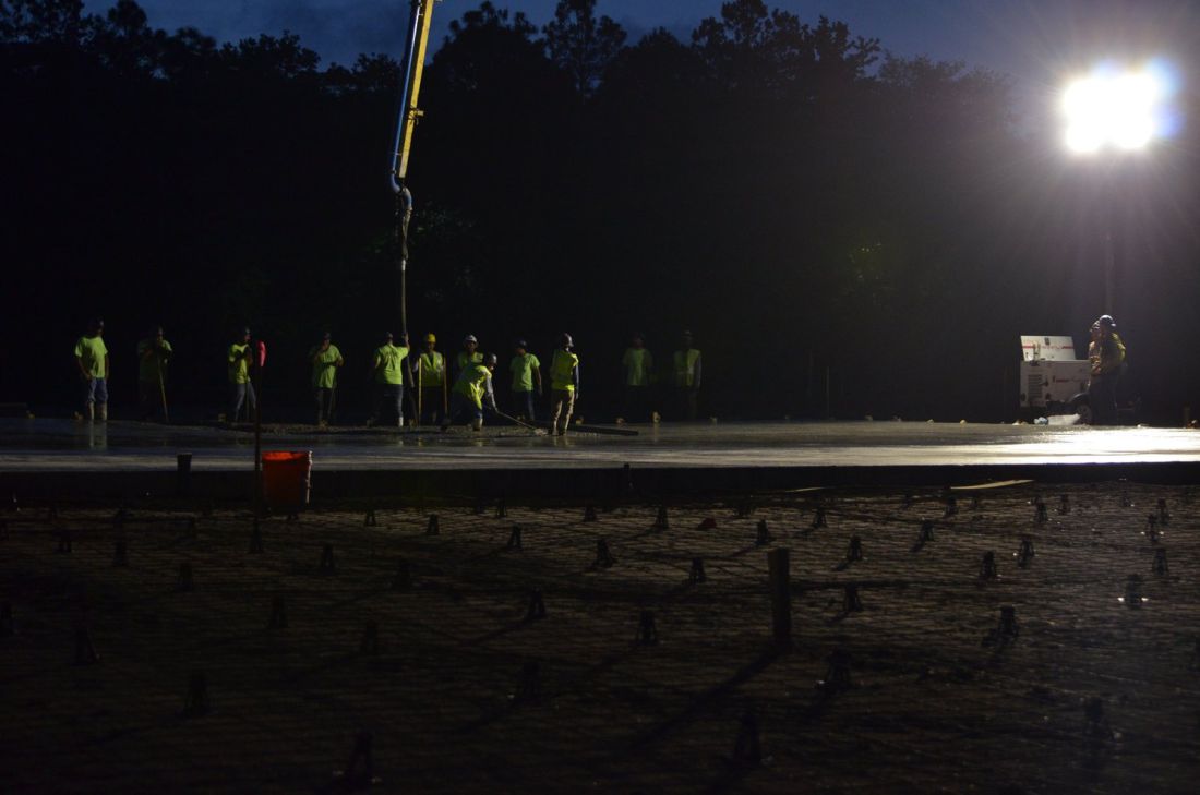 Night placement on a dowelled slab under site lighting